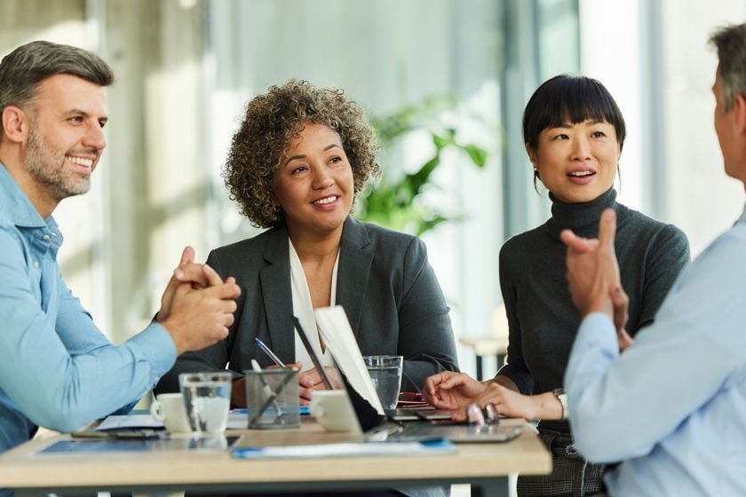 Coworkers Engaging In Conversation 