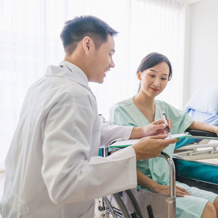 Patient Discussing Treatment With Doctor 