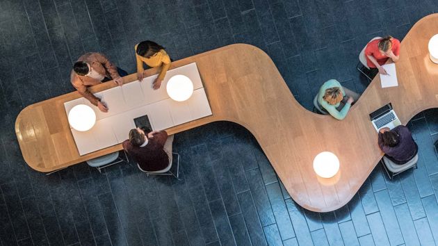 Group Collaborating At Wavy Table 