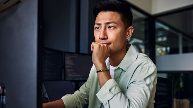 Man Looking At Desktop 