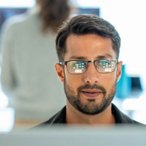 Professional Reviewing Data On Screen 