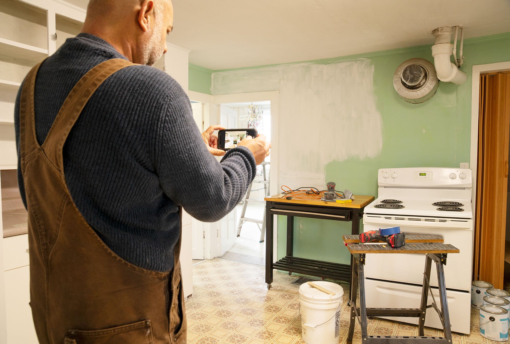 Taking Photos Of Damaged Kitchen 