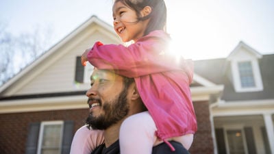 Dad And Daughter In Front Of Home 