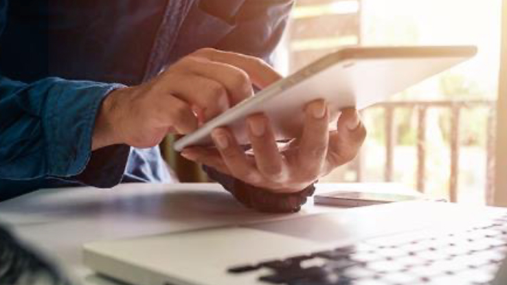 Hands Holding A Tablet 