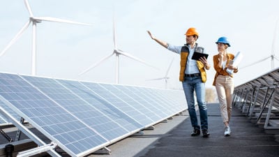Workers At Green Enegy Plant On Tablet 