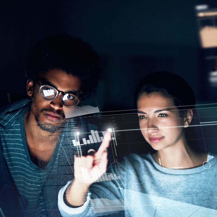 Colleagues Reviewing Predictive Analytics 