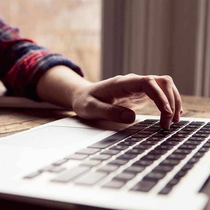 Close Up Of Hand Working On Laptop 