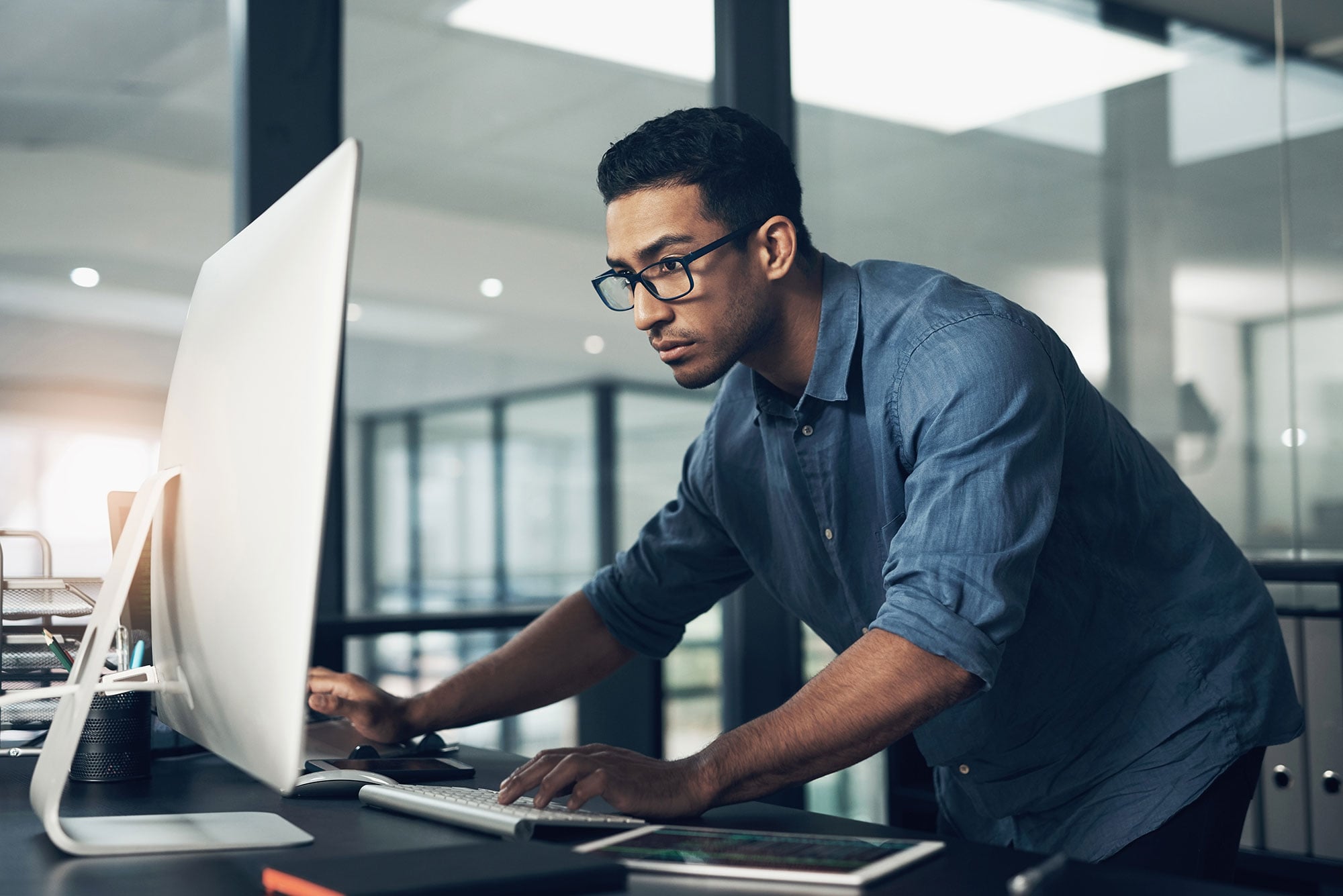 Person Leaning Over Desktop Screen 