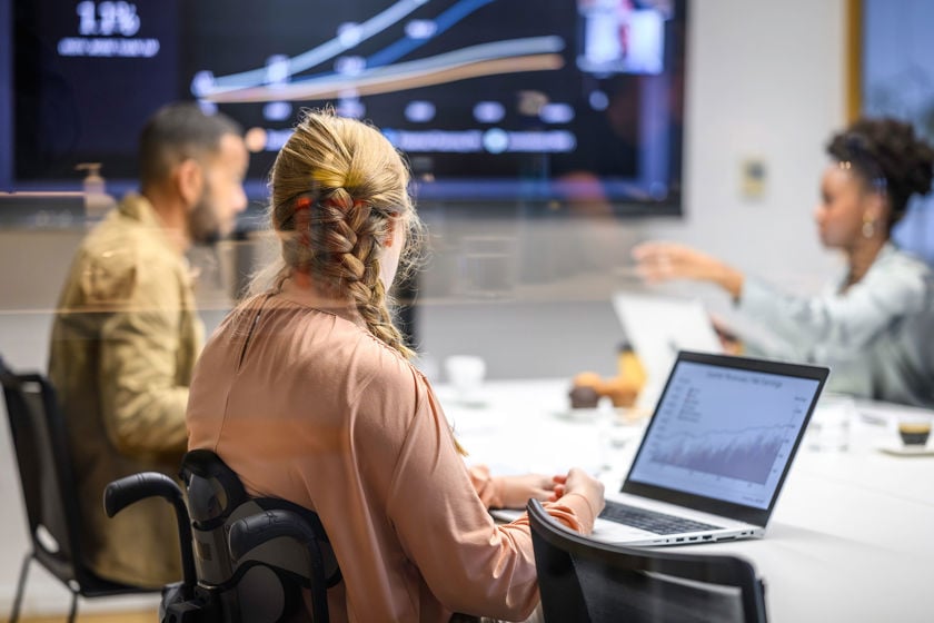 Colleagues Working In Conference Room 