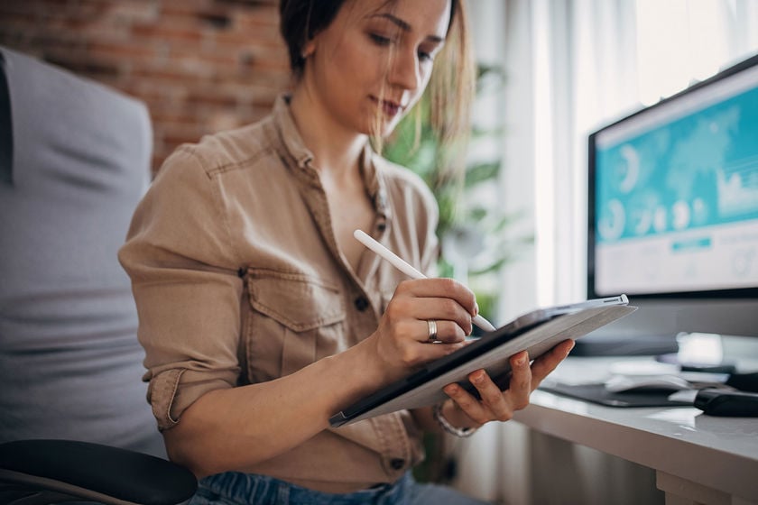 Person Working With Stylus On Tablet 