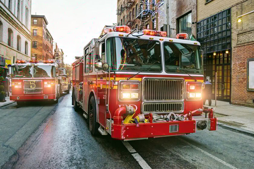 Fire Engines Heading Down City Street