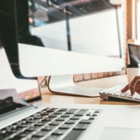 Close Up Of Hands Working At Keyboard 