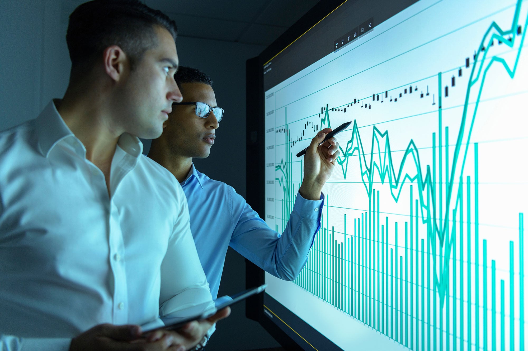 Two Men Reviewing Chart Data 