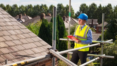 Foreman Reviewing Residential Roof 