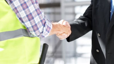 Contractor Shaking Hands With Businessman 
