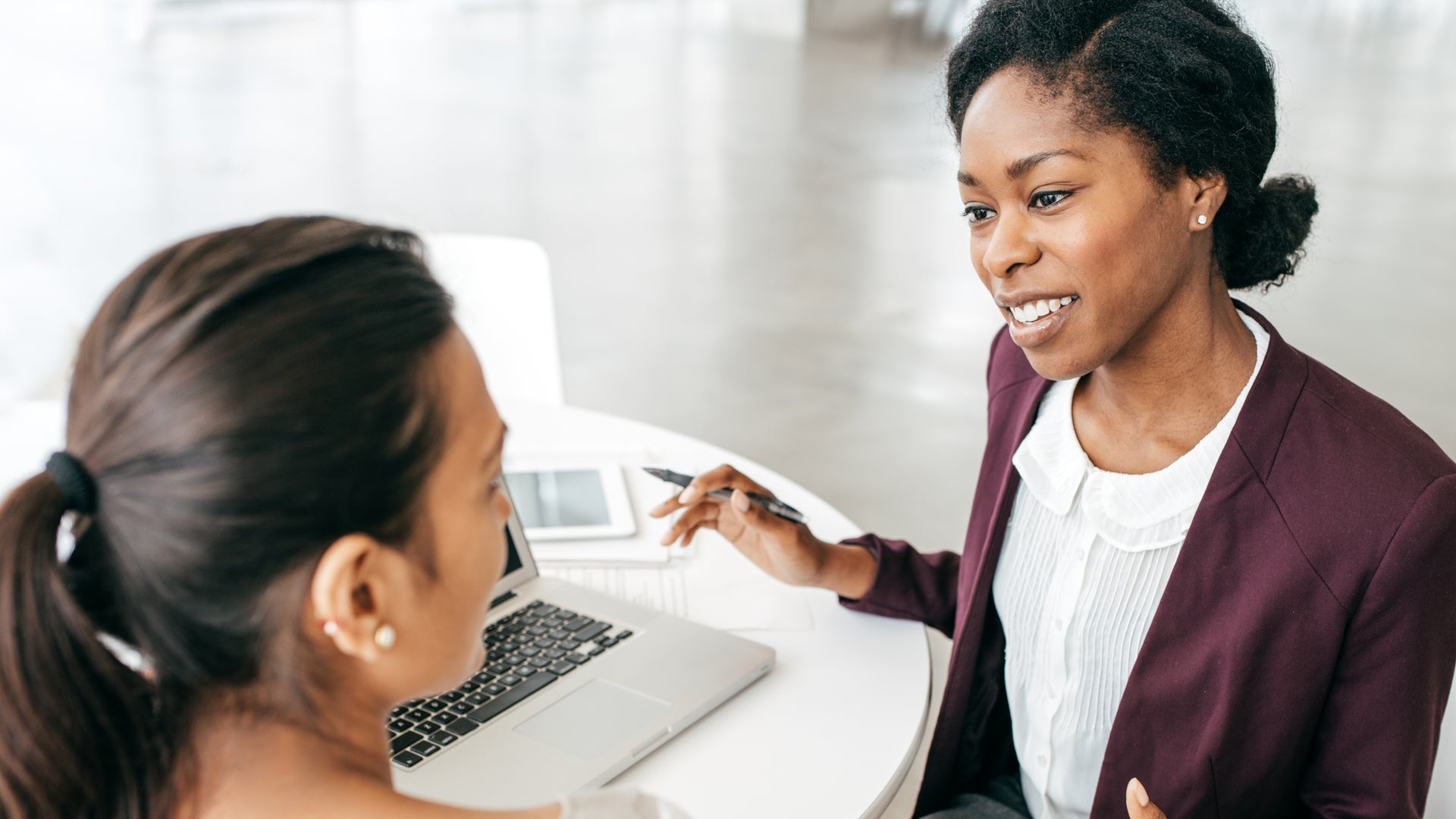 women speaking in the office