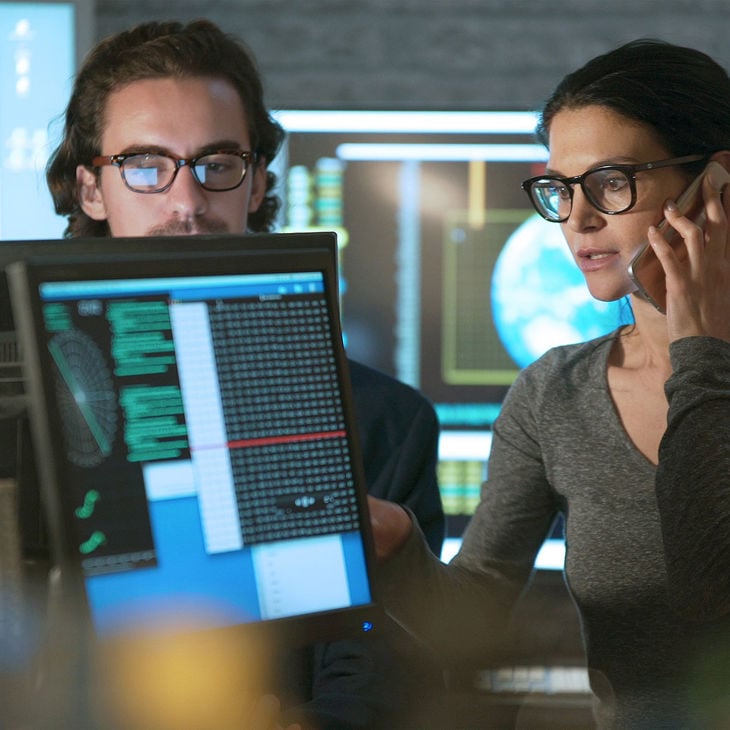 Coworkers Reviewing Storm Data 