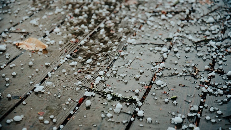 Hail shown on a wooden porch