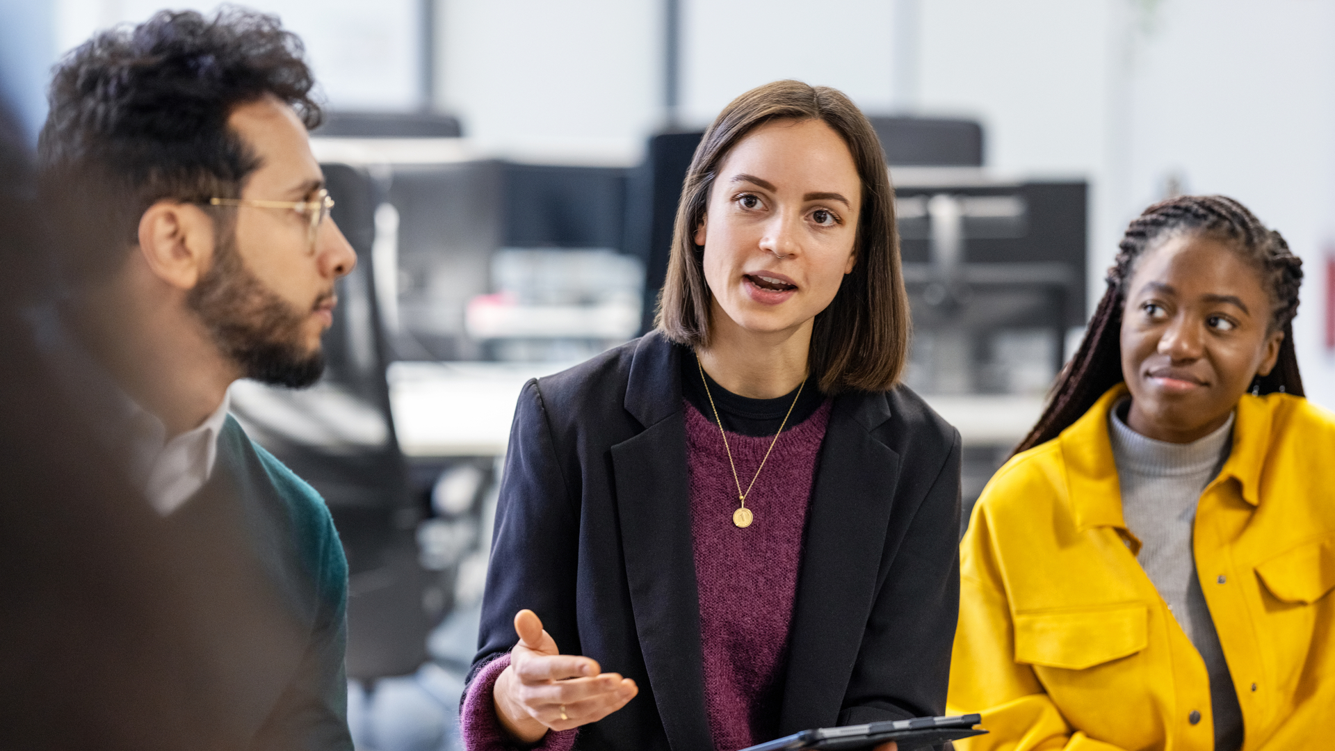 Colleagues talking in a meeting