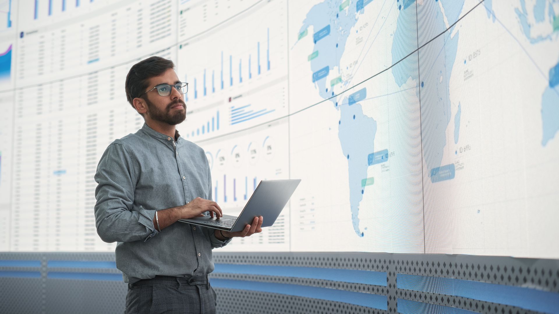 standing man presenting data