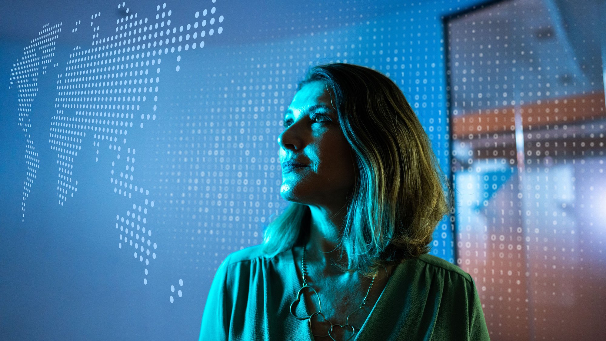 woman-looking-at-world-map-made-of-data