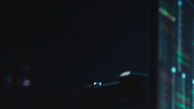 Office Worker Looking At Data In The Evening 