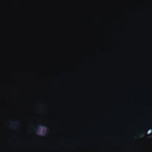 Office Worker Looking At Data In The Evening 