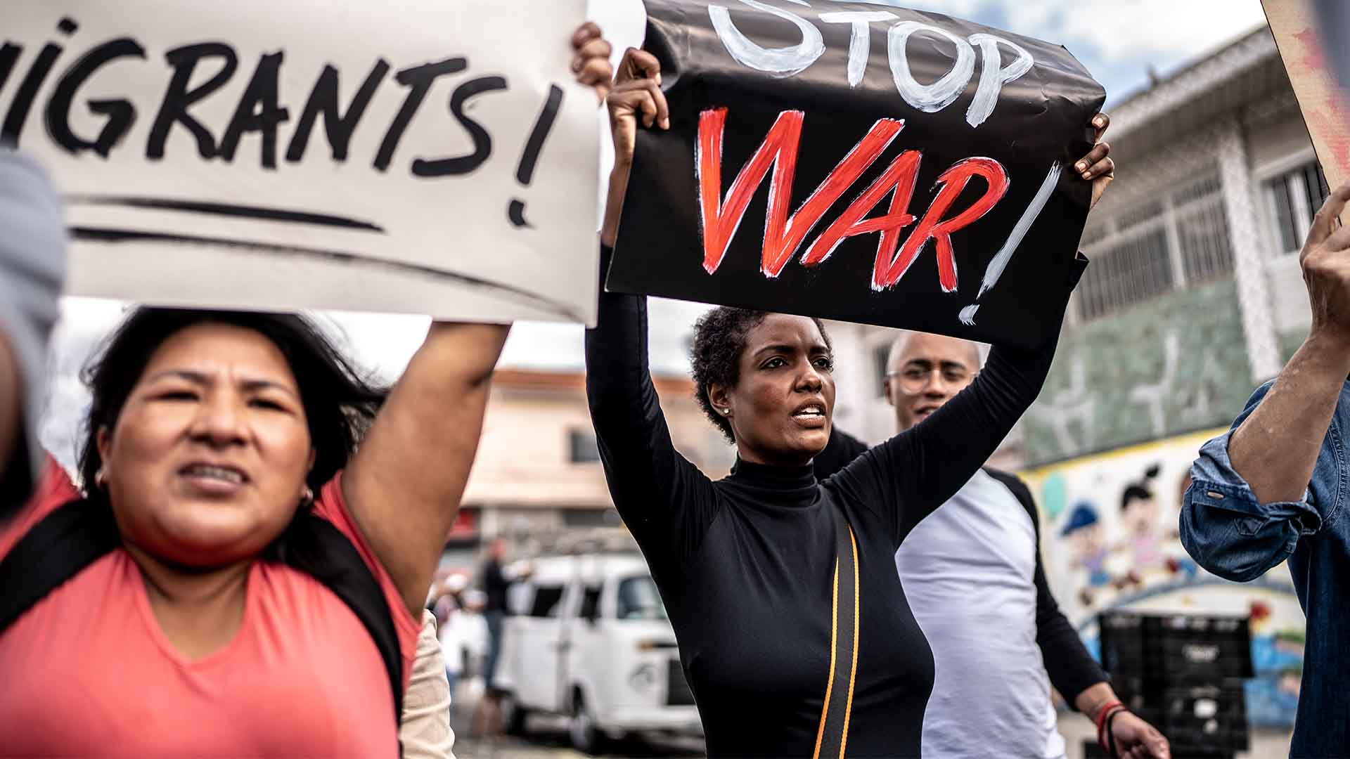 people-protesting-holding-signs-war