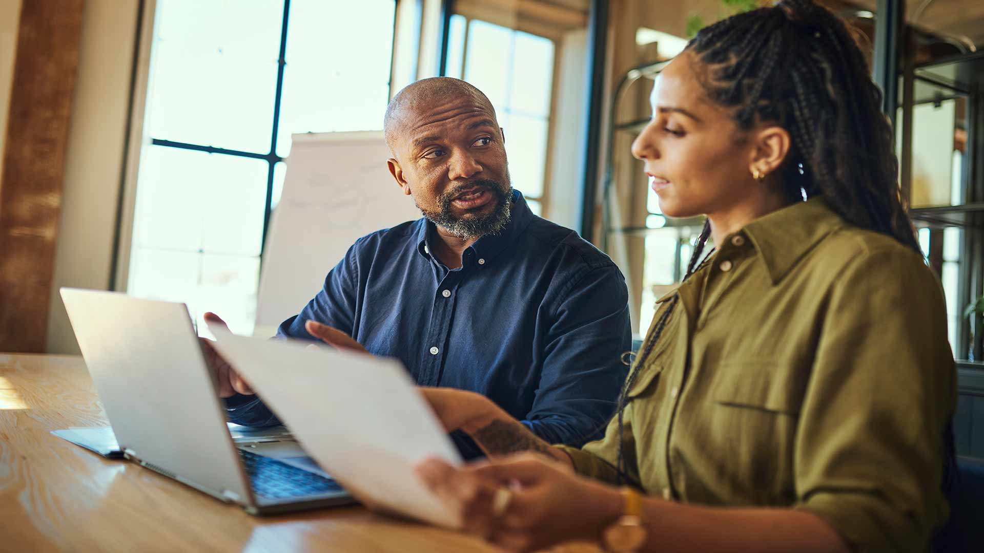 man and woman reviewing work