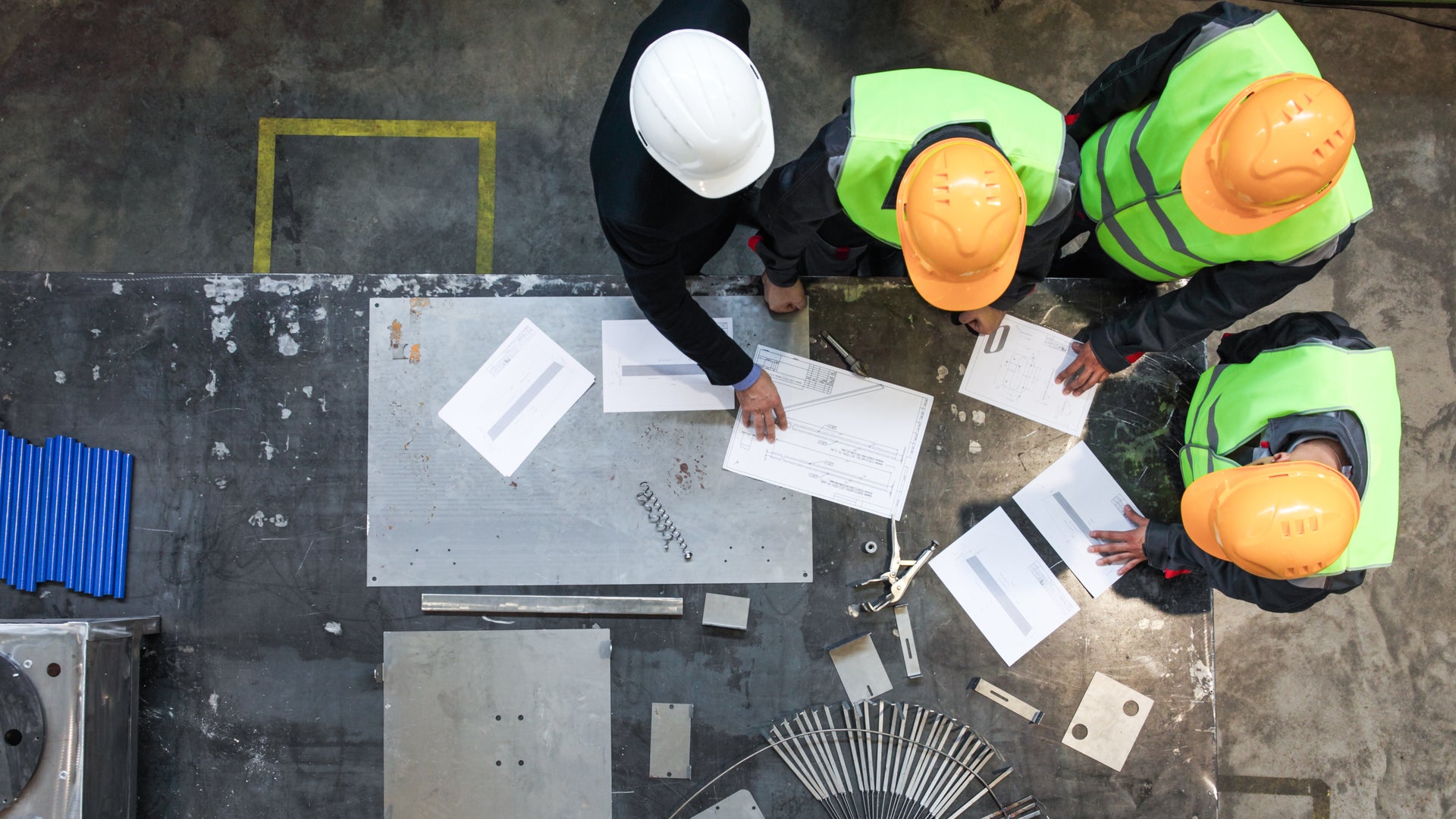 Top Down View Of Construction Site Manager And Workers 
