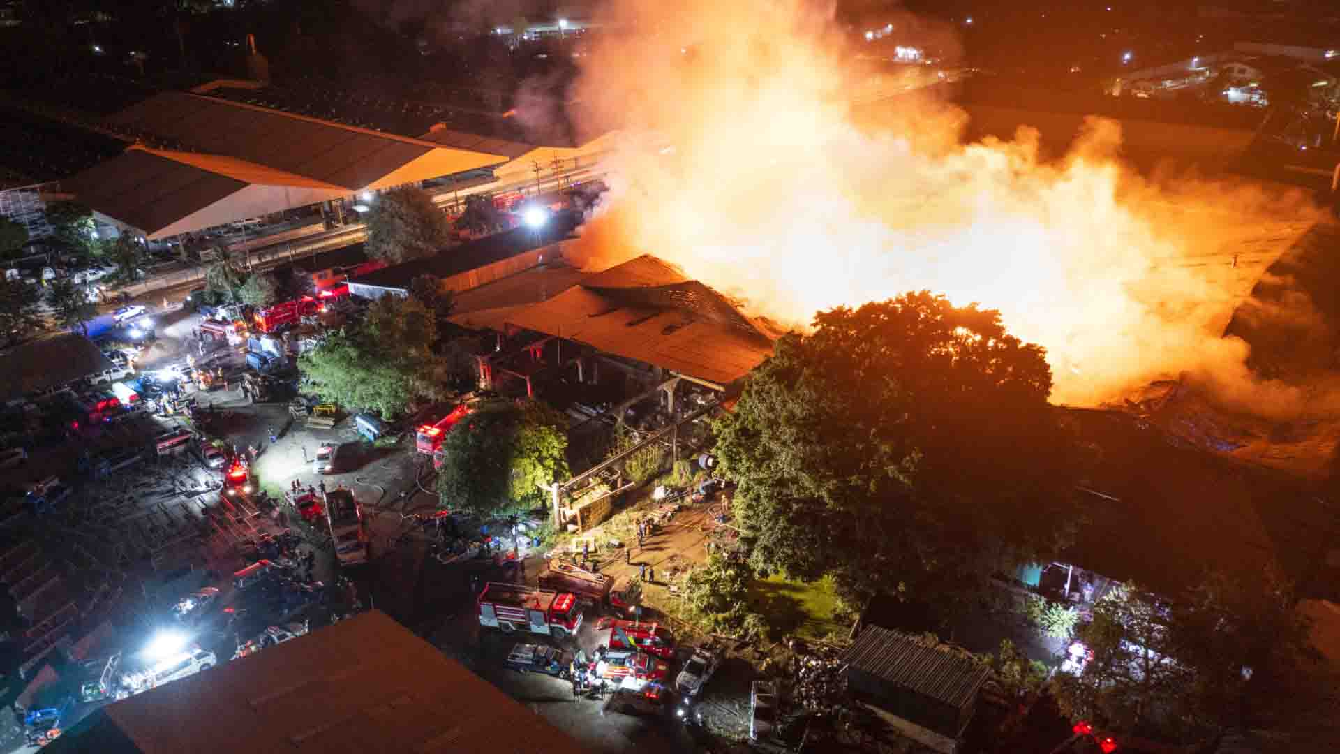 Emergency Personnel At Scene Of Large Fire 