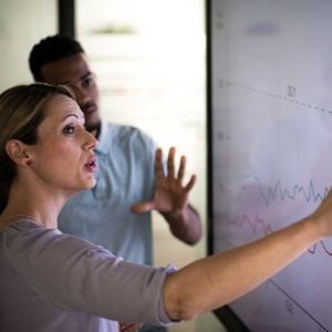 Coworkers Reviewing Charts 
