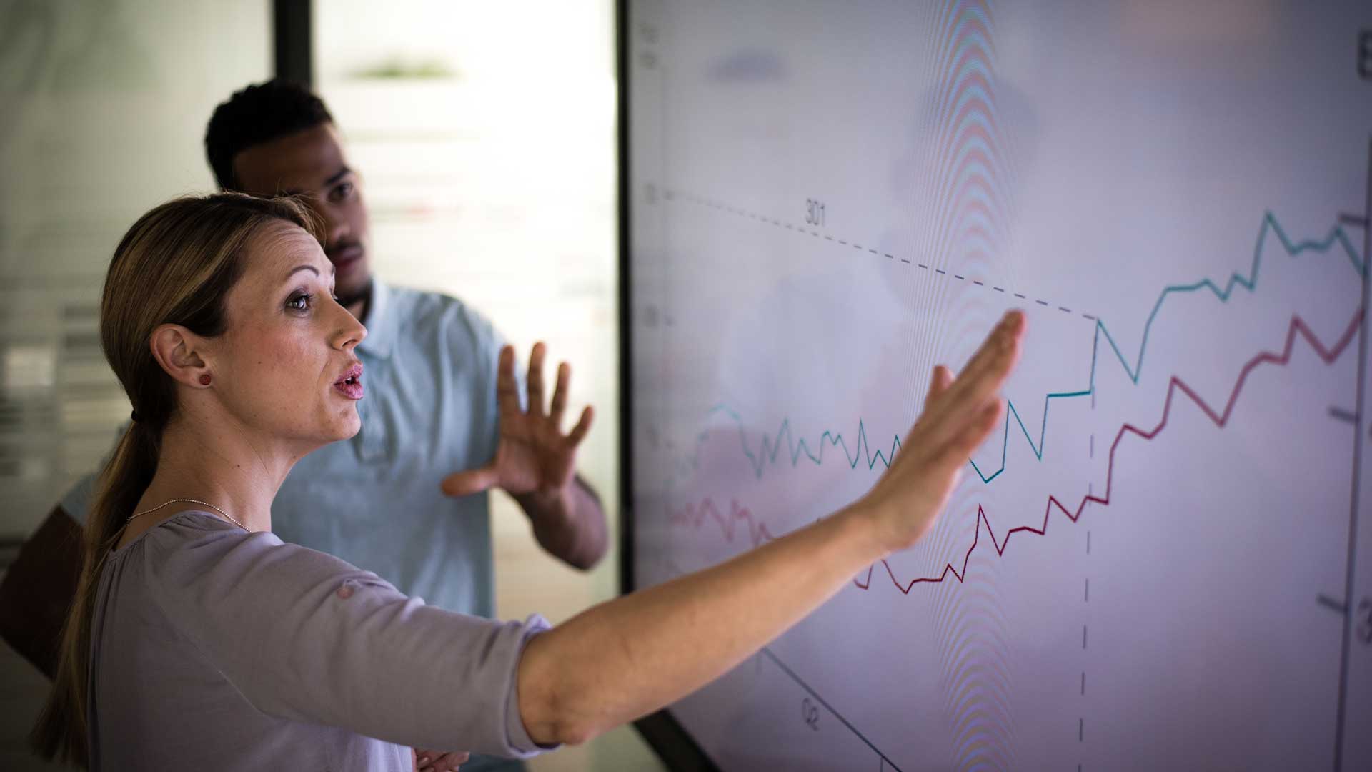 coworkers reviewing charts