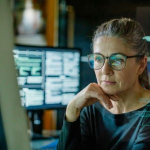 Woman Reviewing Data On Screen Overlay4 