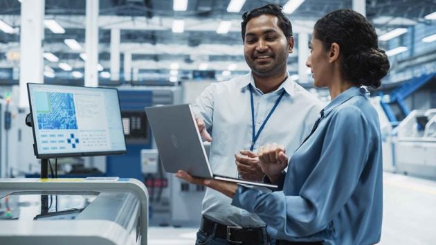 Coworkers Reviewing Work Together 