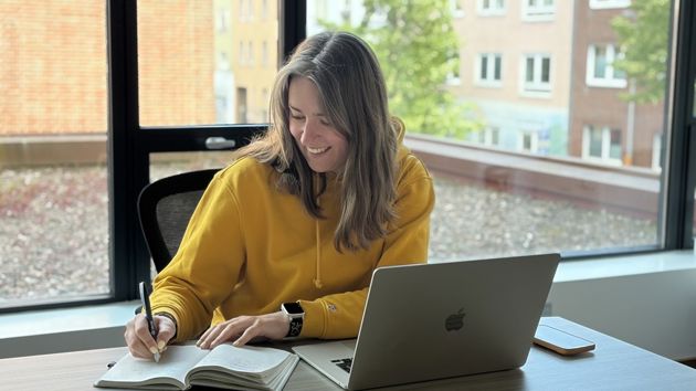Woman Wearing Yellow Writing In Notebook Laptop 