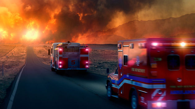 Fire Ambulance Driving On Road Into Wildfires 
