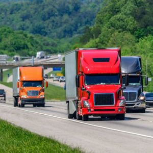 Many Semi Trucks Traveling Down Highway 