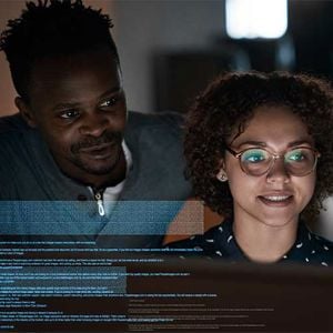 Coworkers Checking Data 