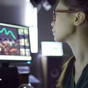 Woman In Glasses Working On Computer 