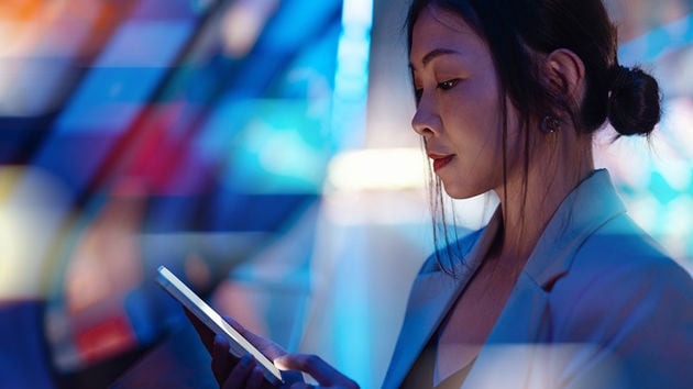 Woman Looking At Mobile Device 