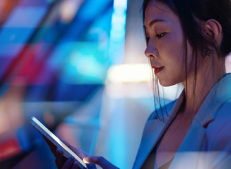 Woman Looking At Mobile Device 