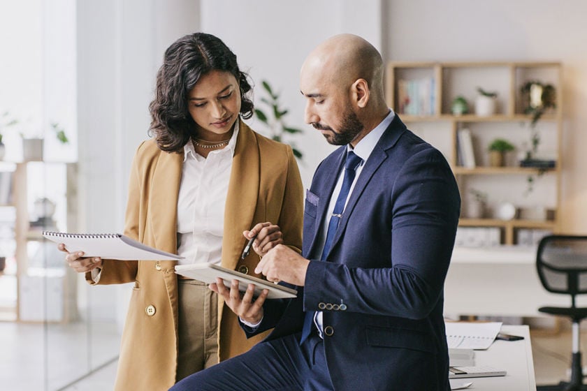 Coworkers Reviewing Data On Tablet Computer 