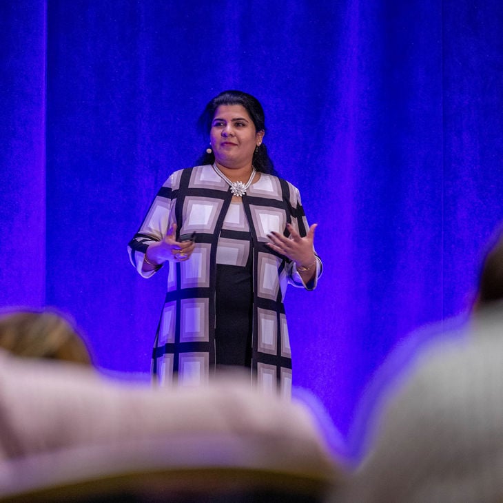 Woman Speaking On Stage 