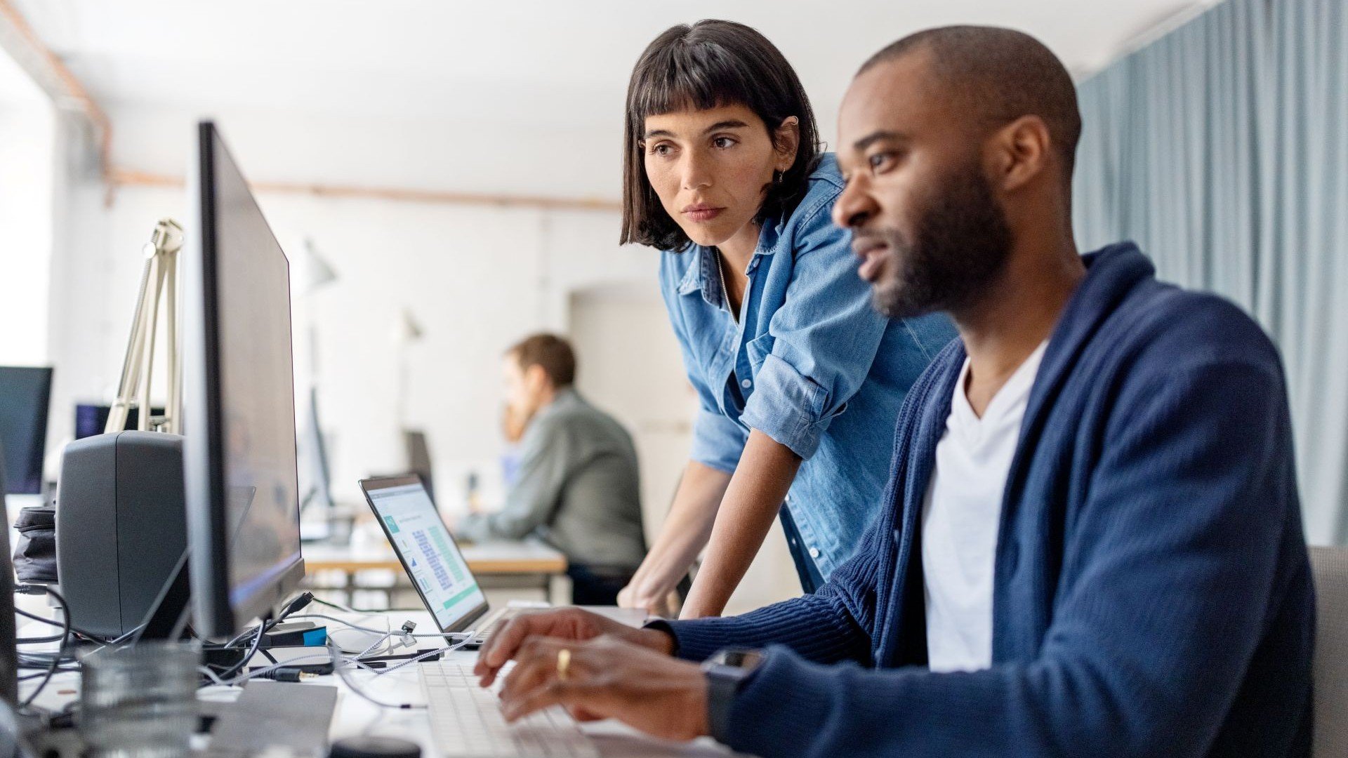 Man Woman Coworkers Typing On Computer 