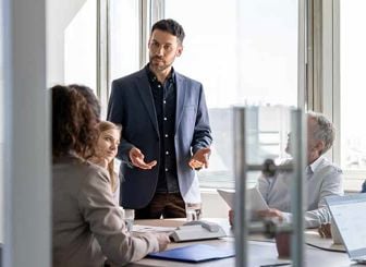 People In Conference Room Discussion 