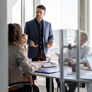 People In Conference Room Discussion 