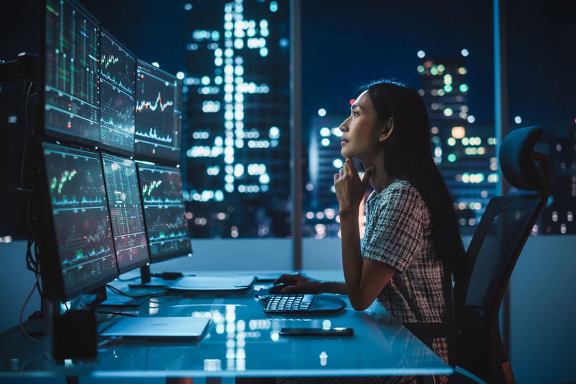 Office Worker Looking At Data In The Evening 