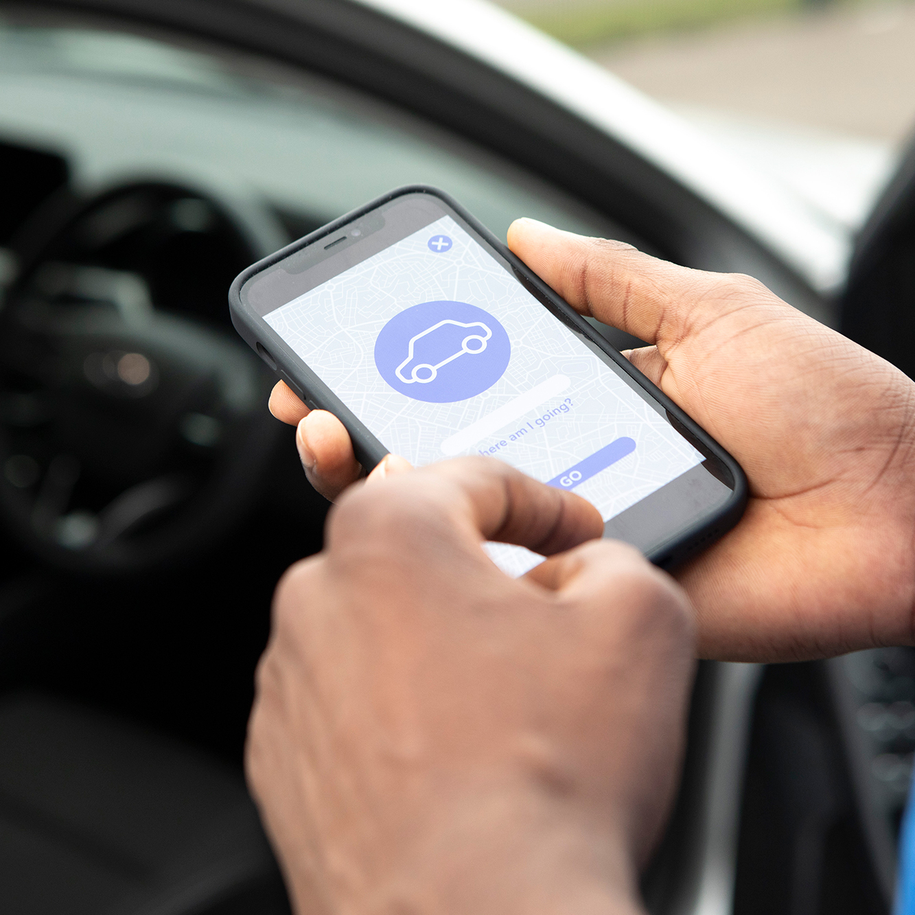 Hand Holding Phone Near Car Door
