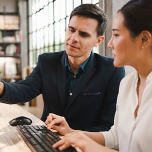 Adjusters Team Reviewing Claims On Computer 